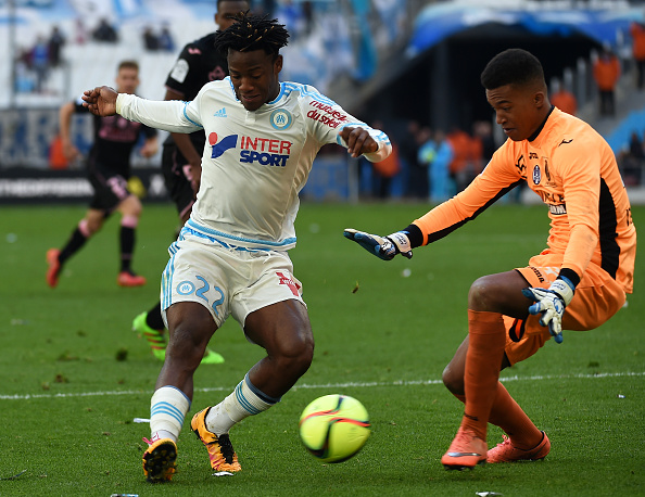 Marseille's Belgian forward Michy Batshuayi (L) vies with Toulouse's goalkeeper Alban Lafont (R) during the French L1 football match between Marseille and Toulouse on March 6, 2016 at the Velodrome stadium in Marseille, southern France. AFP PHOTO / ANNE-CHRISTINE POUJOULAT / AFP / ANNE-CHRISTINE POUJOULAT (Photo credit should read ANNE-CHRISTINE POUJOULAT/AFP/Getty Images)