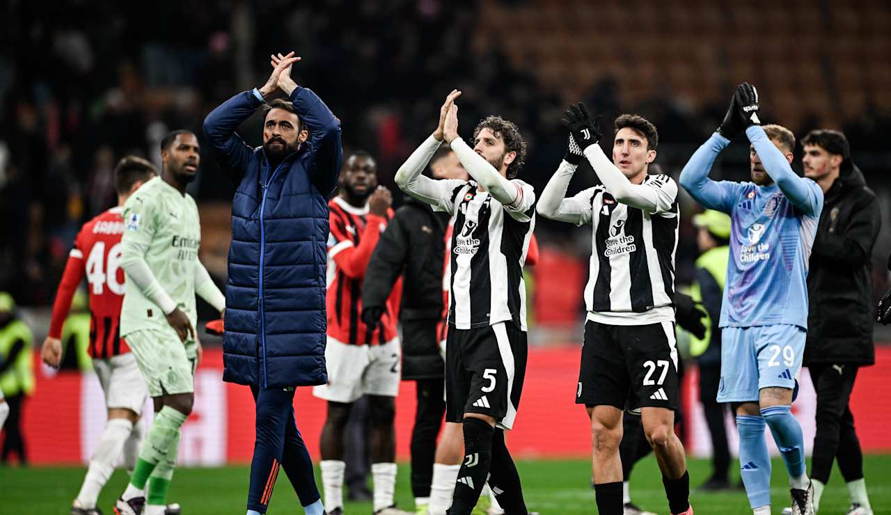 Juventus players salute the traveling supporters at San Siro