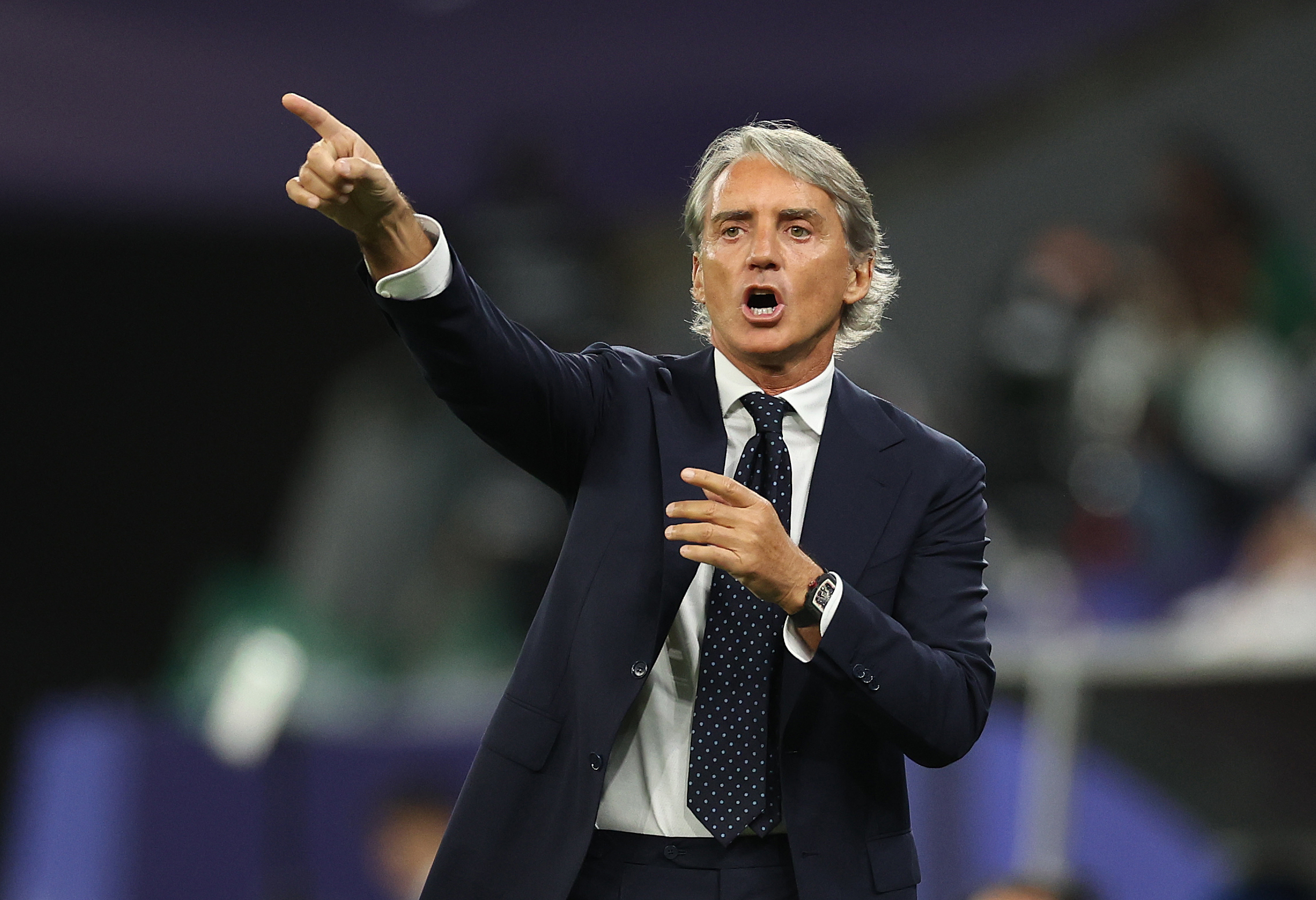 Roberto Mancini giving instructions on the sidelines