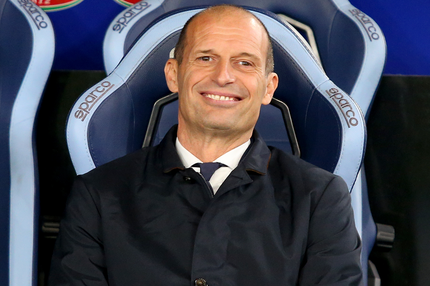 Max Allegri smiling in the dugout
