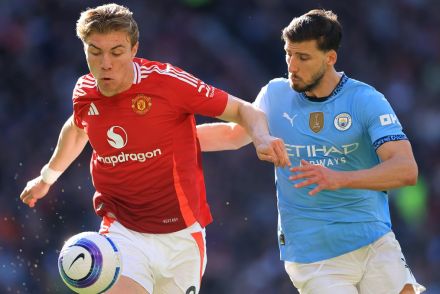 Rasmus Hojlund challenged by Ruben Dias