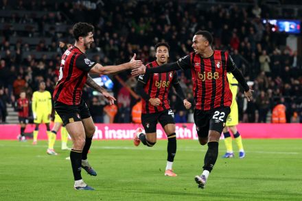 Marcos Senesi celebrating with Bournemouth teammates