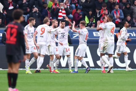 Bayern Munich players celebrate scoring against Bayer Leverkusen