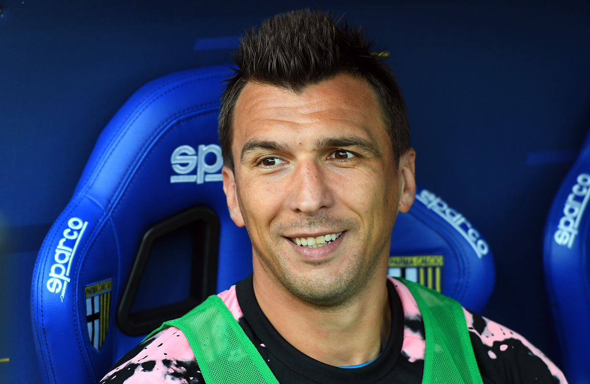 Mario Mandzukic smiling in the dugout