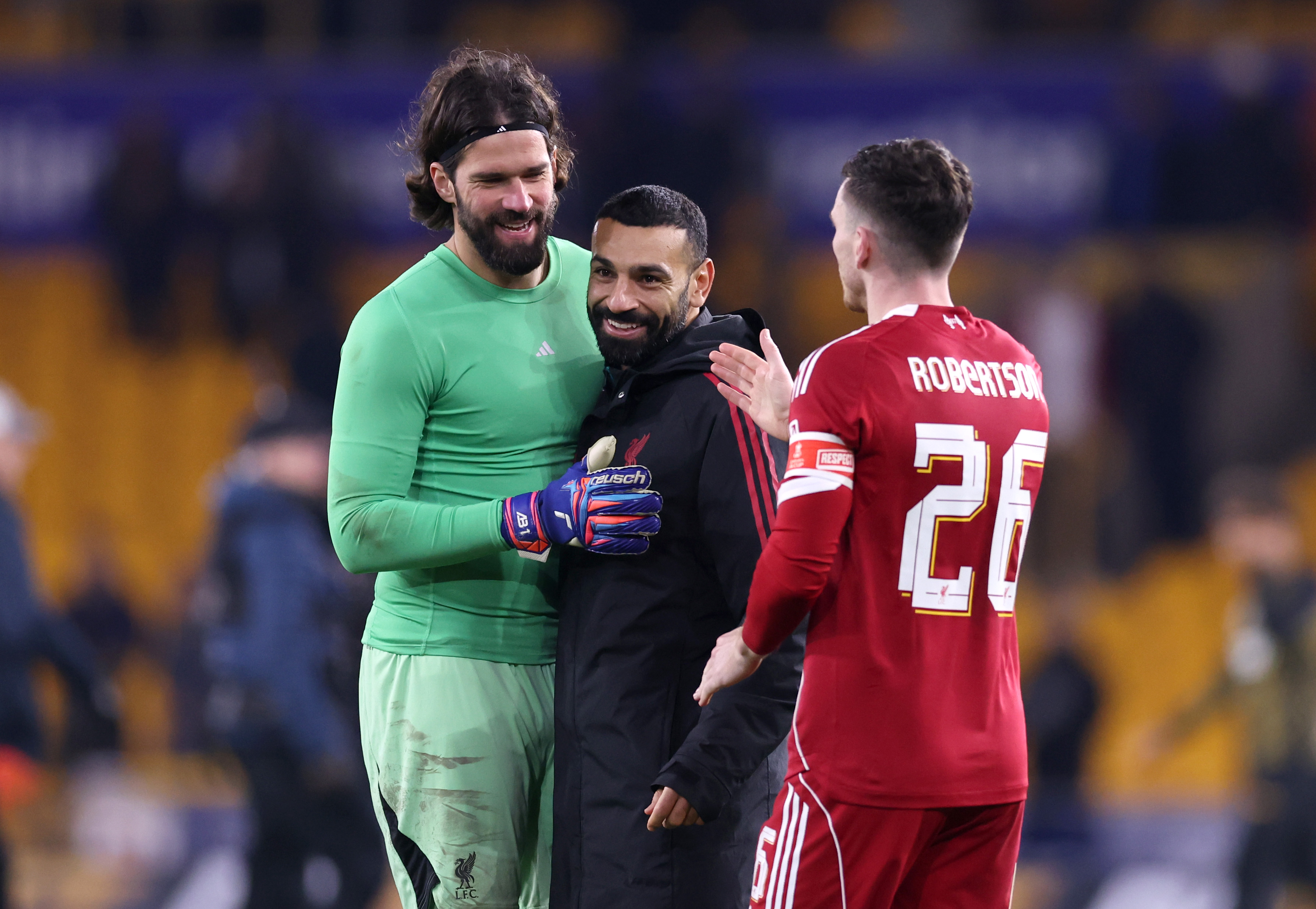Andy Robertson with Mo Salah and Alisson