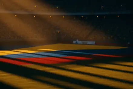 Floodlit World Cup stadium at golden-hour with packed stands, dramatic shadows, and atmospheric lighting—no players visible.