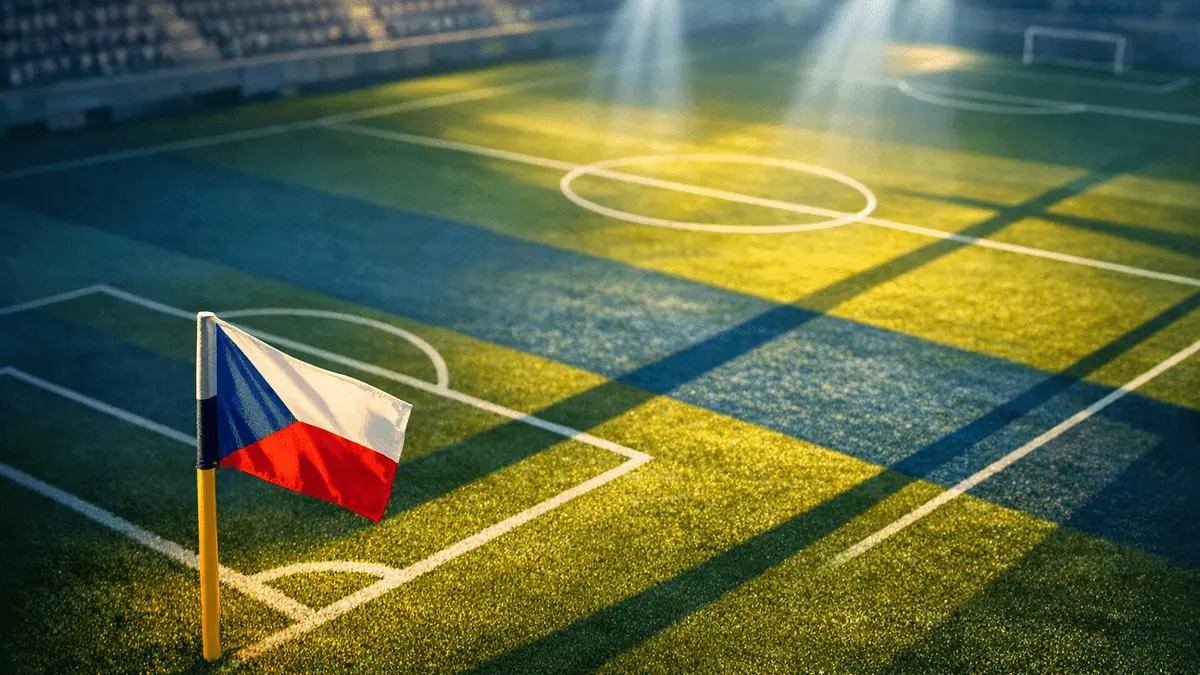 Floodlit football pitch corner flag at dusk with geometric shadows in blue and white tones, editorial sports photography style.