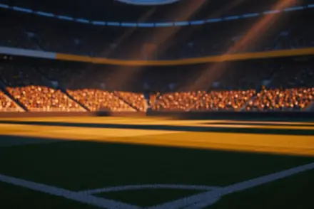 Floodlit stadium pitch at sunset with packed stands in shadow, geometric light patterns, no players visible.