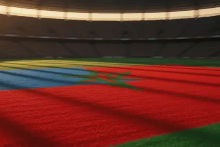 Floodlit World Cup stadium pitch with Morocco red-green and Haiti blue-red flag colours, golden-hour lighting, dramatic shadows, packed stands.