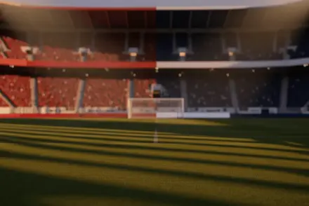 Floodlit stadium pitch at dusk with dramatic shadows, packed stands blurred in background, red-white and navy-blue stadium architecture.