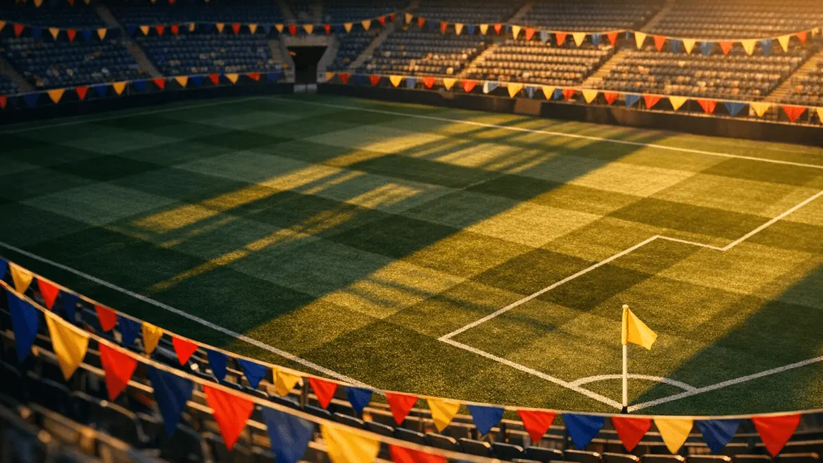 Aerial view of floodlit stadium with colourful bunting in national colours across lower bowl during group-stage pre-match.