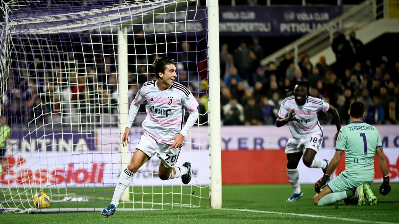 Fabio Miretti in a Juventus kit celebrating a goal near the net