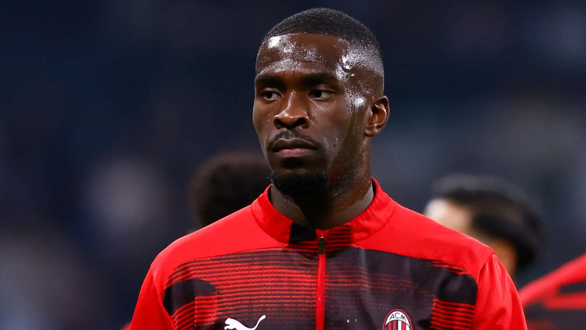 Fikayo Tomori in an AC Milan training kit with a serious expression.