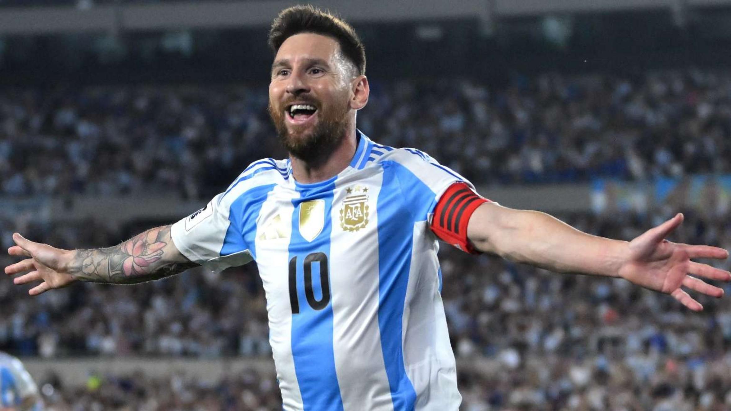 Lionel Messi celebrating with Argentina jersey during a match.