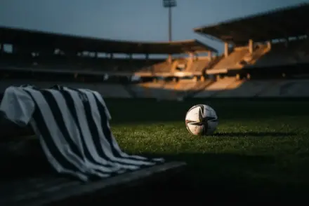 Juventus jersey and football in stadium symbolizing Vlahovic transfer decision