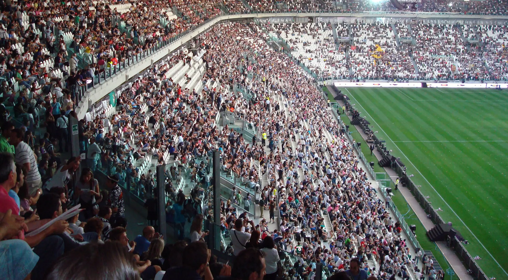 A wide view of the stands filled with fans at the Juventus Stadium.