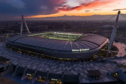 Wide aerial view of the Allianz Stadium in Turin at sunset