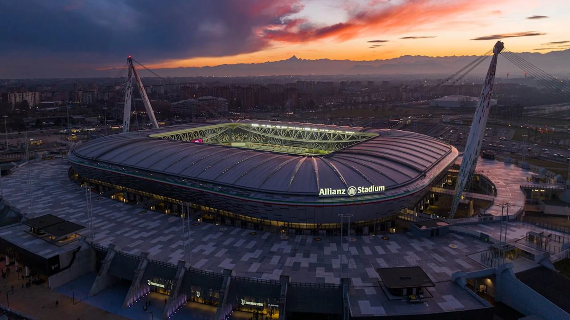 Wide aerial view of the Allianz Stadium in Turin at sunset